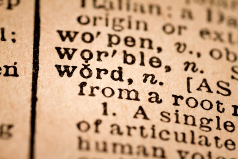 A close up of a dictionary highlighting the word "worrible" - a term generated through text.